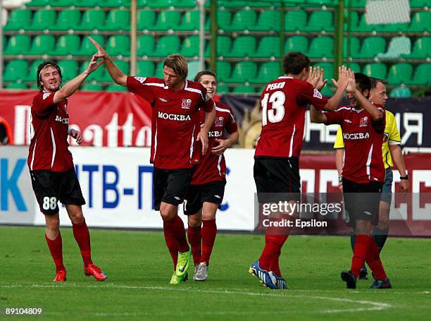 Edgaras Cesnauskis, Dmitri Tarasov, Aleksei Rebko and Aleksandr Samedov of FC Moscow celebrate after scoring a goal during the Russian Football...