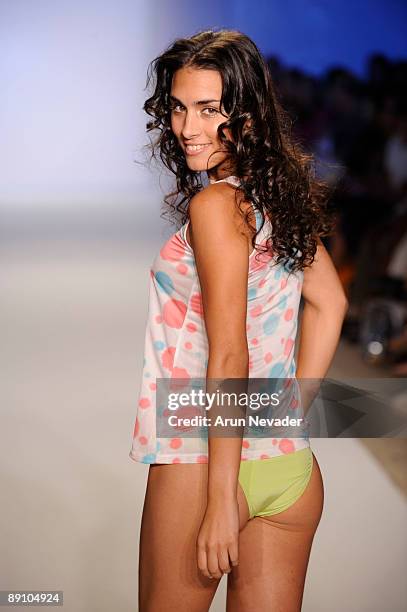 Model walks the runway at the White Sands Australia fashion show at The Beachway on July 18, 2009 in Miami, Florida.