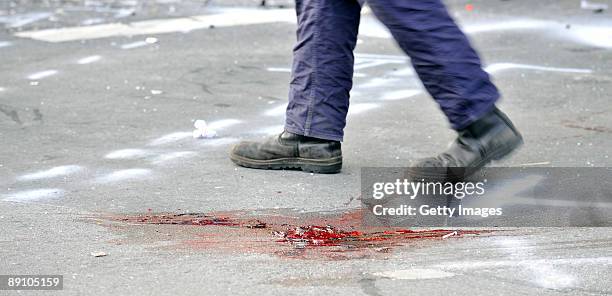 Blood marks the scene during accident clearance on July 19, 2009 in Menden near Arnsberg, Germany. A car rammed a parade in the German town of Menden...