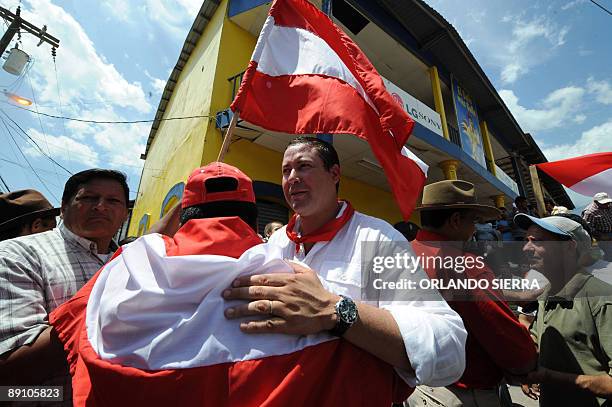 Carlos Eduardo Reina , the coordinator of the Honduran Liberal Party greets membgers of the party during a protest in support of Honduran ousted...