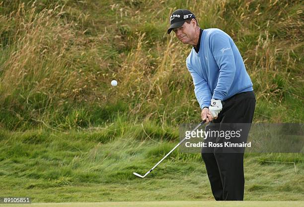 Tom Watson of USA hits a pitch shot on the final payoff hole with Stewart Cink following the final round of the 138th Open Championship on the Ailsa...