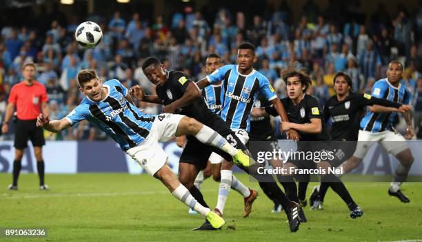 Walter Kannemann of Gremio and Oscar Murillo of CF Pachuca contest for a header during the FIFA Club World Cup UAE 2017 semi-final match between...