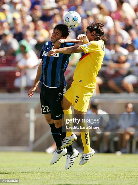 Diego Milito of Inter Milan and Ricardo Rojas of Club America battle for the ball in the first half during the World Football Challenge at Stanford...