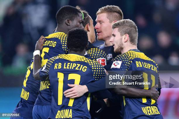 Marcel Halstenberg of RB Leipzig celebrates with his team mates after scoring the equalizing goal to make it 1-1 during the Bundesliga match between...