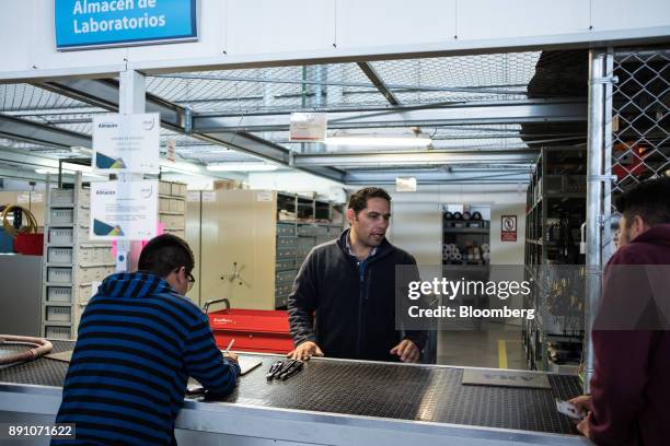 Students check out equipment for a class at the University of Aeronautics in Queretaro in the town of Colon, Queretaro state, Mexico, on Tuesday,...