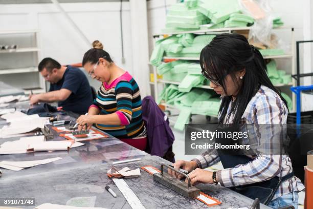 Workers assembly aircraft heat shields at the Tighitco Inc. Manufacturing facility in San Luis Potosi, Mexico, on Thursday, Nov. 16, 2017. With 312...