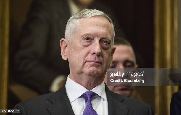 Jim Mattis, U.S. Secretary of defense, watches as U.S. President Donald Trump, not pictured, signs the National Defense Authorization Act for fiscal...