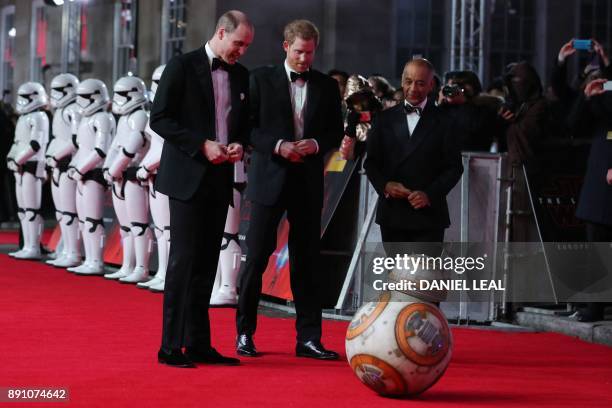 Britain's Prince William , Duke of Cambridge and Prince Harry are greeted by droid BB-8 as they arrive for the European Premiere of Star Wars: The...