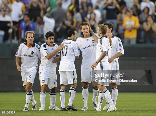 The Los Angeles Galaxy celebrates after Alan Gordon scores a goal against AC Milan during the first half of the MLS match at The Home Depot Center on...