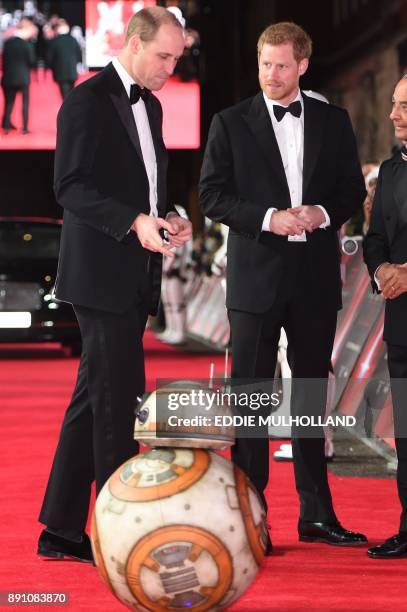 Britain's Prince William , Duke of Cambridge and Prince Harry are greeted by droid BB-8 as they arrive for the European Premiere of Star Wars: The...