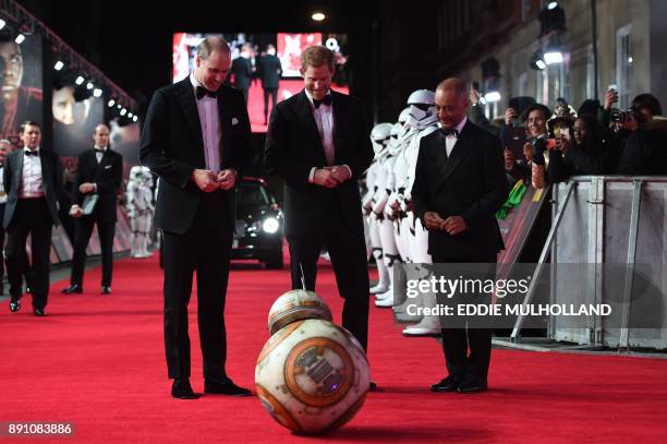 Britain's Prince William , Duke of Cambridge and Prince Harry are greeted by droid BB-8 as they arrive for the European Premiere of Star Wars: The...