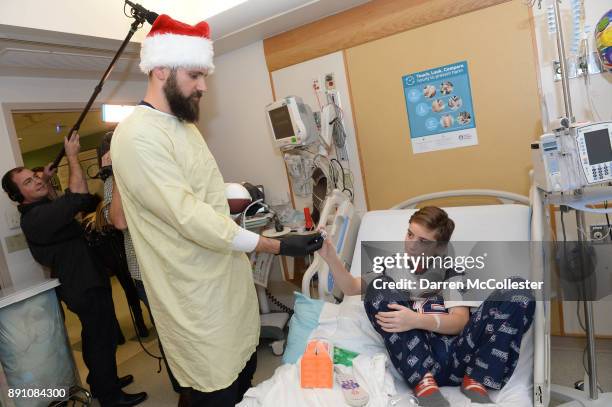 New England Patriot alumni Sebastian Vollmer visits with Mike at Boston Children's Hospital December 12, 2017 in Boston, Massachusetts.