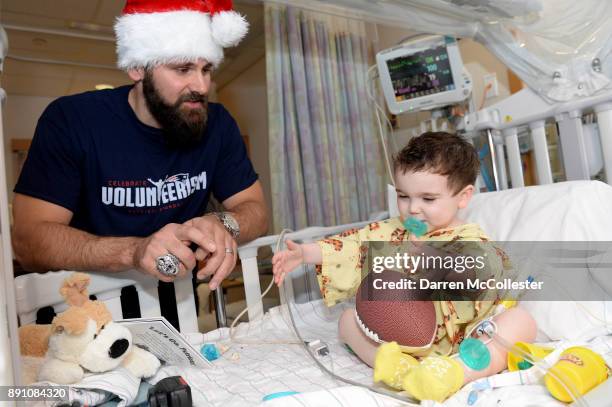 Sebastian Vollmer visits with Sasha at Boston Children's Hospital December 12, 2017 in Boston, Massachusetts.