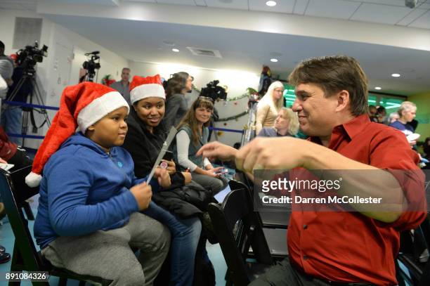 Boston Pops conductor Keith Lockhart and Jabbar at the Boston Pops Holiday Concert at Boston Children's Hospital December 12, 2017 in Boston,...