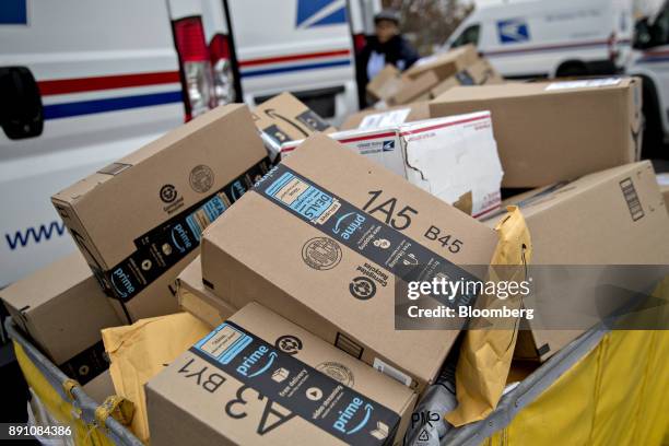 Amazon.com Inc. Packages sit in a bin before being placed on a delivery vehicle at the United States Postal Service Joseph Curseen Jr. And Thomas...