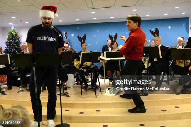 New England Patriot alumni Sebastian Vollmer performs "Twas The Night Before Christmas" with Keith Lockhart at the Boston Pops Holiday Concert at...