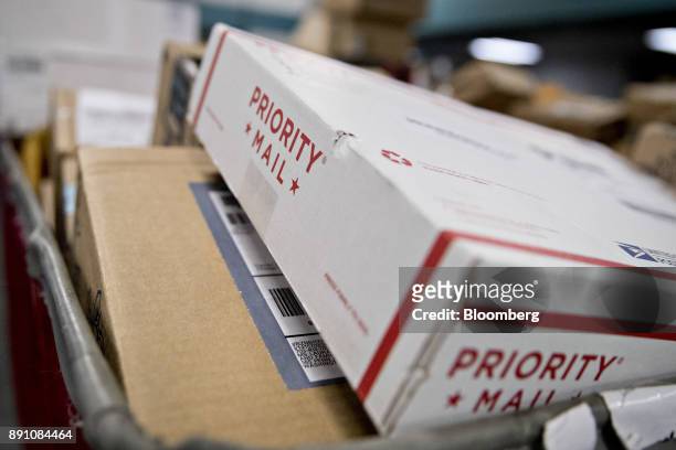 Priority mail package sits in a bin before delivery at the United States Postal Service Joseph Curseen Jr. And Thomas Morris Jr. Processing and...
