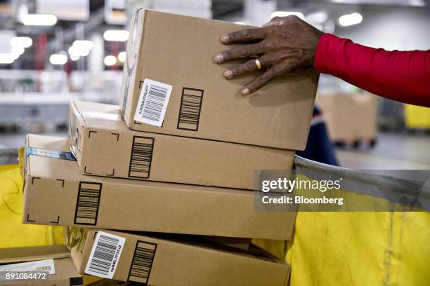 Letter carrier sorts packages for delivery at the United States Postal Service Joseph Curseen Jr. And Thomas Morris Jr. Processing and distribution...