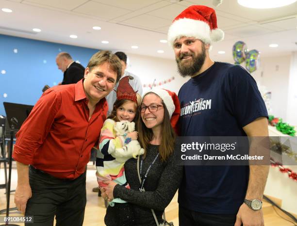 Keith Lockhart and Sebastian Vollmer with Grace and Mom after the Boston Pops Holiday Concert at Boston Children's Hospital December 12, 2017 in...