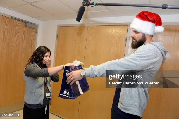 Boston Children's Hospital Marisa Silva RN,BSN,CPN, is surprised by New England Patriot Alumni Sebastian Vollmer with Super Bowl LII tickets at...