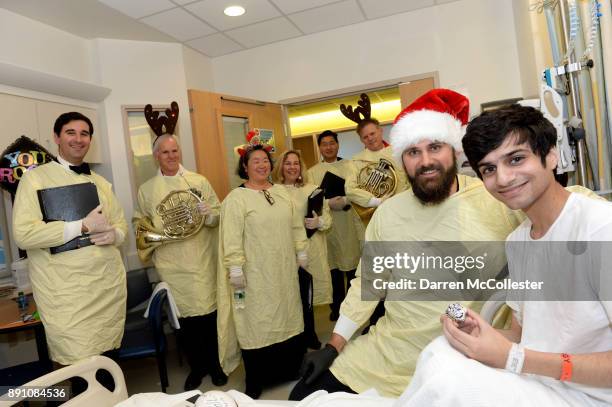 Sebastian Vollmer and members of the Rhythm and Brass section of the Boston Pops visit with Alexander at Boston Children's Hospital December 12, 2017...