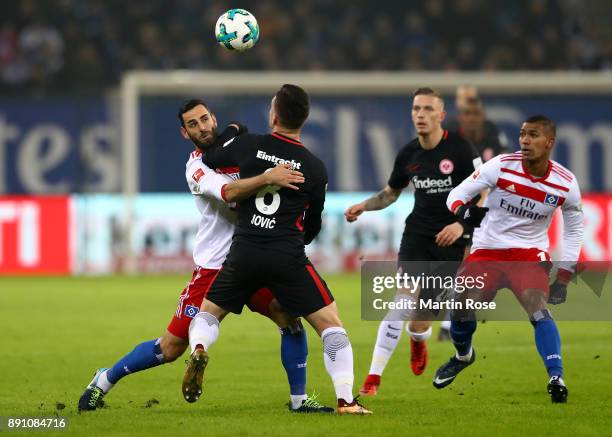 Mergim Mavraj of Hamburg and Luka Jovic of Frankfurt battle for the during the Bundesliga match between Hamburger SV and Eintracht Frankfurt at...