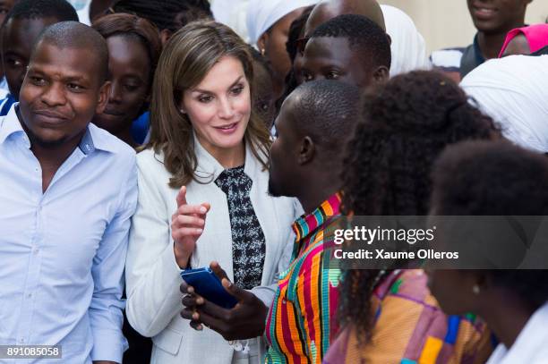 Queen Letizia of Spain talks with students as she visits the Cervantes Institute on December 12, 2017 in Dakar, Senegal. Queen Letizia of Spain is on...