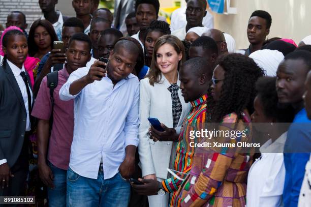 Queen Letizia of Spain poses for a selfie as she visits the Cervantes Institute on December 12, 2017 in Dakar, Senegal. Queen Letizia of Spain is on...
