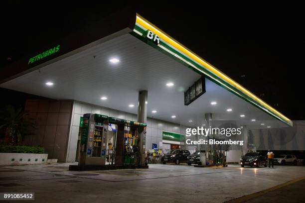 Petrobras Distribuidora SA gas station stands illuminated at night in Sao Paulo, Brazil, on Monday, Dec. 11, 2017. Petroleo Brasileiro SA is getting...