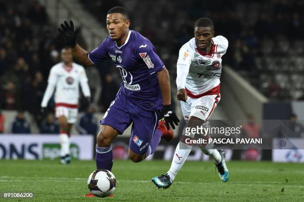 Toulouse's French defender Kelvin Amian vies for the ball with Bordeaux's Senegalese midfielder Younousse Sankhare during the French League Cup round...