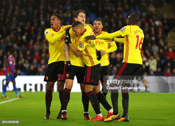 Daryl Janmaat of Watford celebrates with his teammates after scoring his sides first goal during the Premier League match between Crystal Palace and...