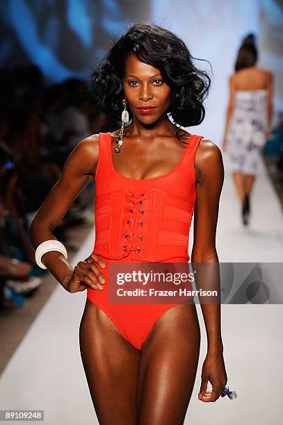 Model walks the runway at the V Del Sol 2010 fashion show during Mercedes-Benz Fashion Week Swim at the Cabana Grande at The Raleigh on July 19, 2009...