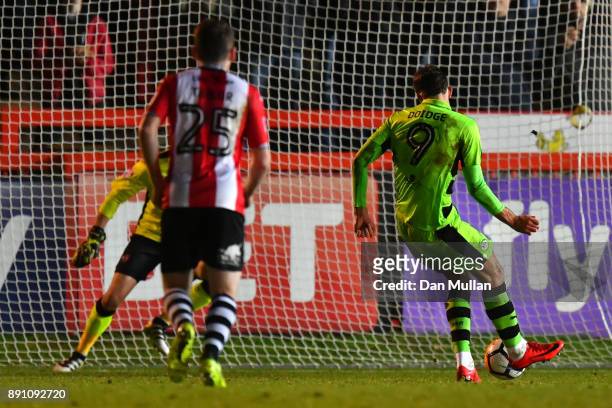 Christian Doidge of Forest Green Rovers scores a penalty during the Emirates FA Cup Second Round Replay between Exeter City and Forest Green at St...