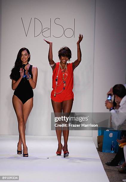 Designer Veronique de la Cruz and a model walk the runway at the V Del Sol 2010 fashion show during Mercedes-Benz Fashion Week Swim at the Cabana...