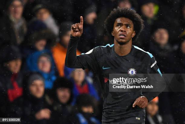 Willian of Chelsea celebrates after scoring his sides second goal during the Premier League match between Huddersfield Town and Chelsea at John...