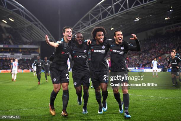 Cesar Azpilicueta, Victor Moses, Willian, and Pedro of Chelsea celebrate Pedro's goal during the Premier League match between Huddersfield Town and...