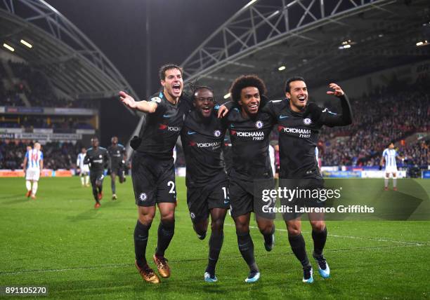 Cesar Azpilicueta, Victor Moses, Willian, and Pedro of Chelsea celebrate Pedro's goal during the Premier League match between Huddersfield Town and...