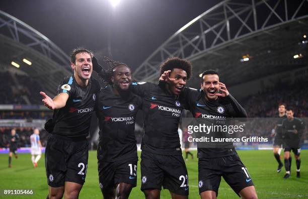 Cesar Azpilicueta, Victor Moses, Willian, and Pedro of Chelsea celebrate Pedro's goal during the Premier League match between Huddersfield Town and...
