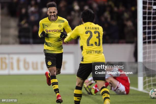 Shinji Kagawa of Borussia Dortmund celebrates with Pierre-Emerick Aubameyang after scoring his team's second goal to make it 0-2 during the...