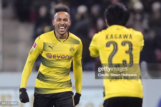 Shinji Kagawa of Borussia Dortmund celebrates with Pierre-Emerick Aubameyang after scoring his team's second goal to make it 0-2 during the...