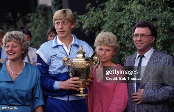 Boris Becker of Germany holding the trophy after winning the Wimbledon Lawn Tennis Championships held at the All England Club in London, England...