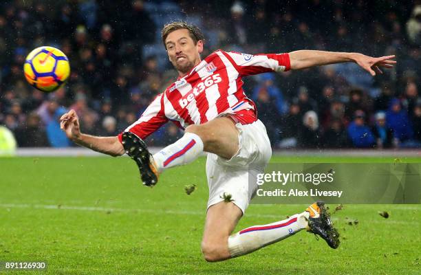 Peter Crouch of Stoke City reaches for the ball during the Premier League match between Burnley and Stoke City at Turf Moor on December 12, 2017 in...