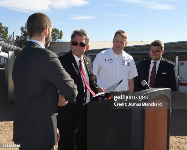 San Bernardino Mayor Carey Davis presents a certificate to Kevin Rabinovitch, Global VP of Sustainability for Mars, Stuart Harness, Plant Manager for...