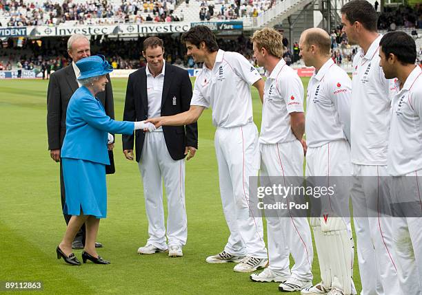 Queen Elizabeth II is introduced to the England team and shakes hands with Alastair Cook during day two of the npower 2nd Ashes Test Match between...