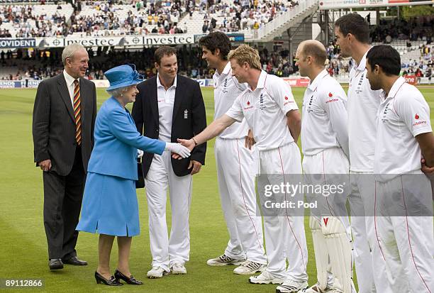 Queen Elizabeth II is introduced to the England team and shakes hands with Paul Collingwood during day two of the npower 2nd Ashes Test Match between...