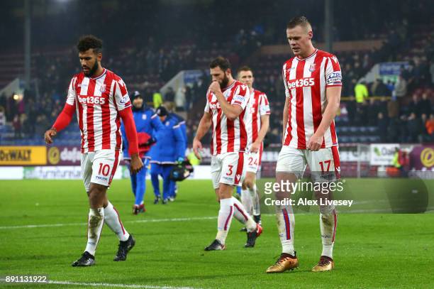 Stoke City players look dejected as they leave the pitch after losing the Premier League match between Burnley and Stoke City at Turf Moor on...