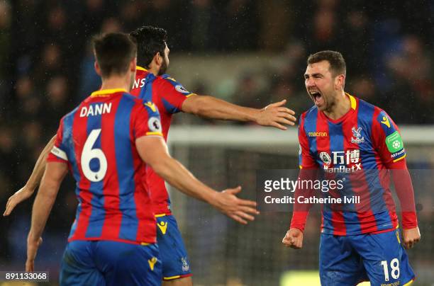 James McArthur of Crystal Palace celebrates after scoring his sides second goal with teammates during the Premier League match between Crystal Palace...