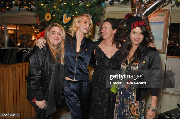 Katie Lyall, Poppy Delevingne, Katie Grand and Charlotte Stockdale attend the Love x Chaos x Poppy Delevingne x Moet Christmas Party at George on...