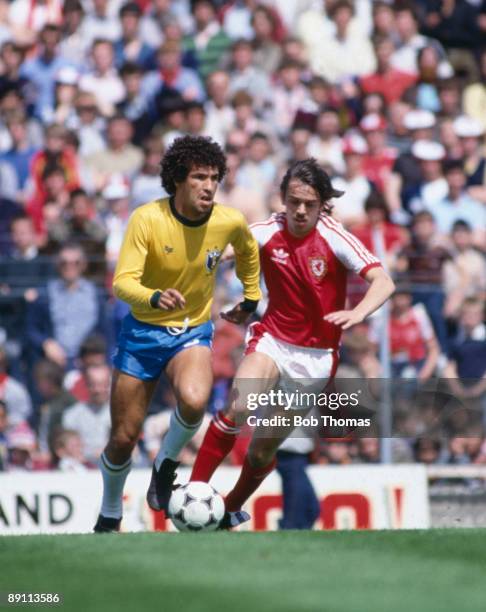 Brazilian striker Careca moves away from Wales' Alan Davies during the International friendly at Ninian Park in Cardiff, 12th June 1983. The match...