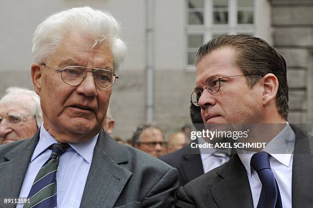 Franz Ludwig Schenk Count von Stauffenberg , son of Count Claus von Stauffenberg, speaks with German Economic Minister Karl-Theodor zu Guttenberg on...